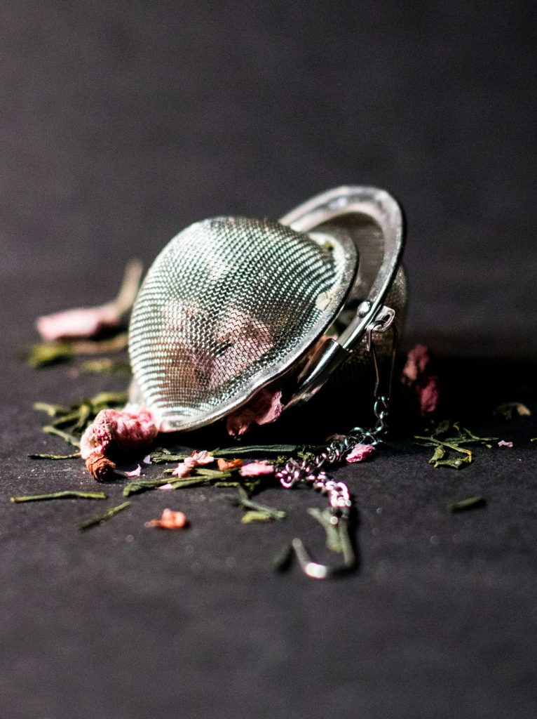 selective focus photography of round silver-colored accessory